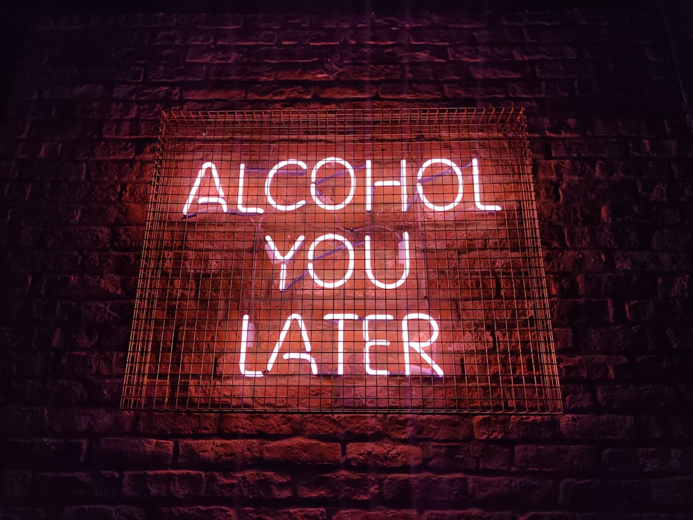 a neon sign that reads alcohol you later