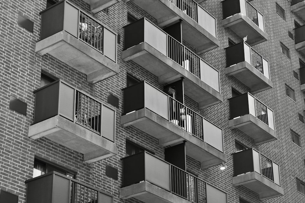 a tall brick building with balconies and balconies