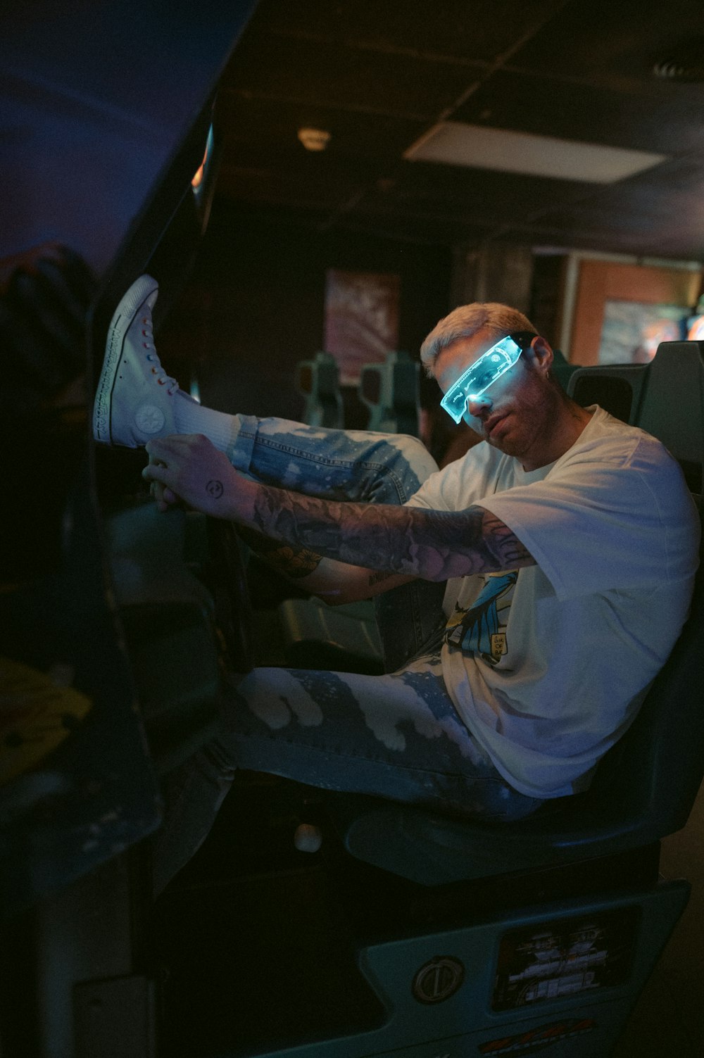 a man sitting in a chair wearing a pair of 3d glasses