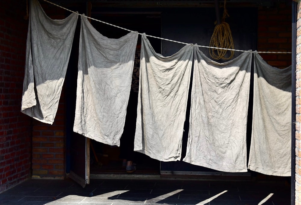 a line of clothes hanging on a clothes line