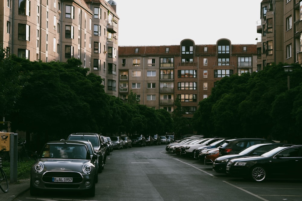 a row of cars parked on the side of a road