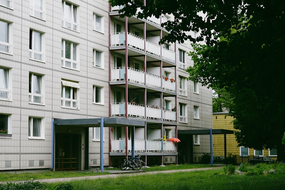 an apartment building with a bicycle parked in front of it