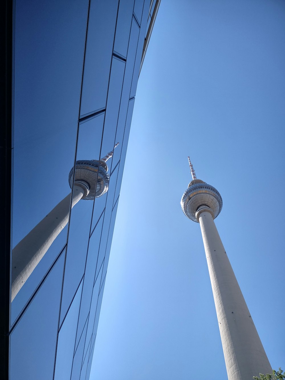 two tall white towers against a blue sky