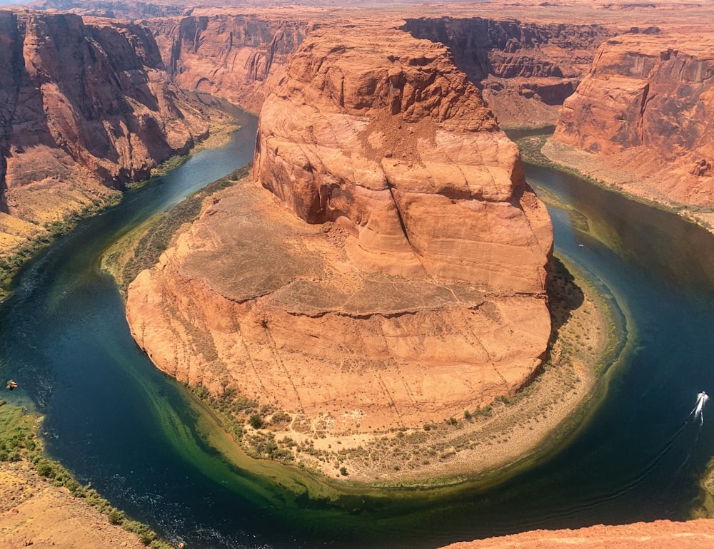 a river flowing through a canyon surrounded by mountains