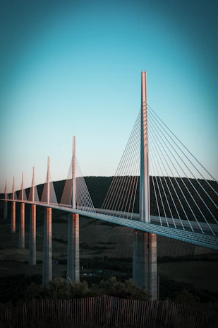 a very tall bridge spanning over a large body of water