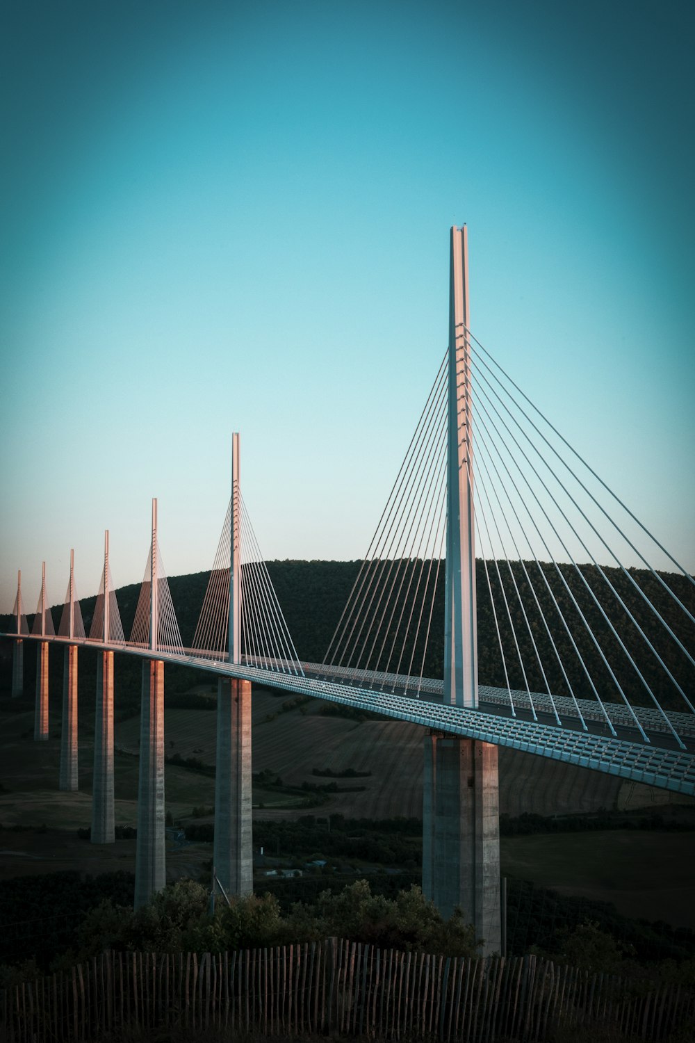 a very tall bridge spanning over a large body of water