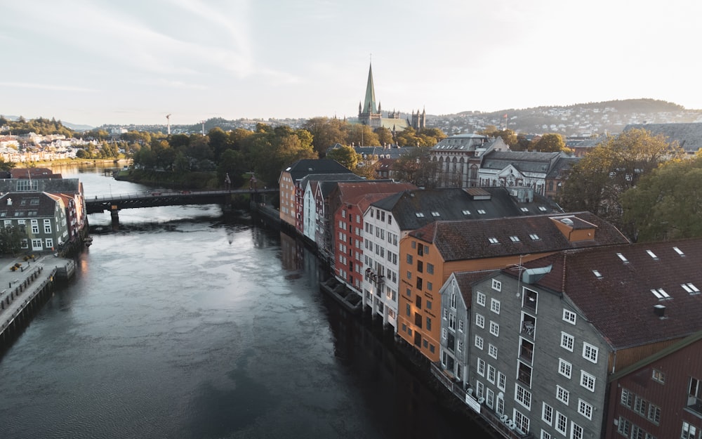 a river running through a city next to tall buildings