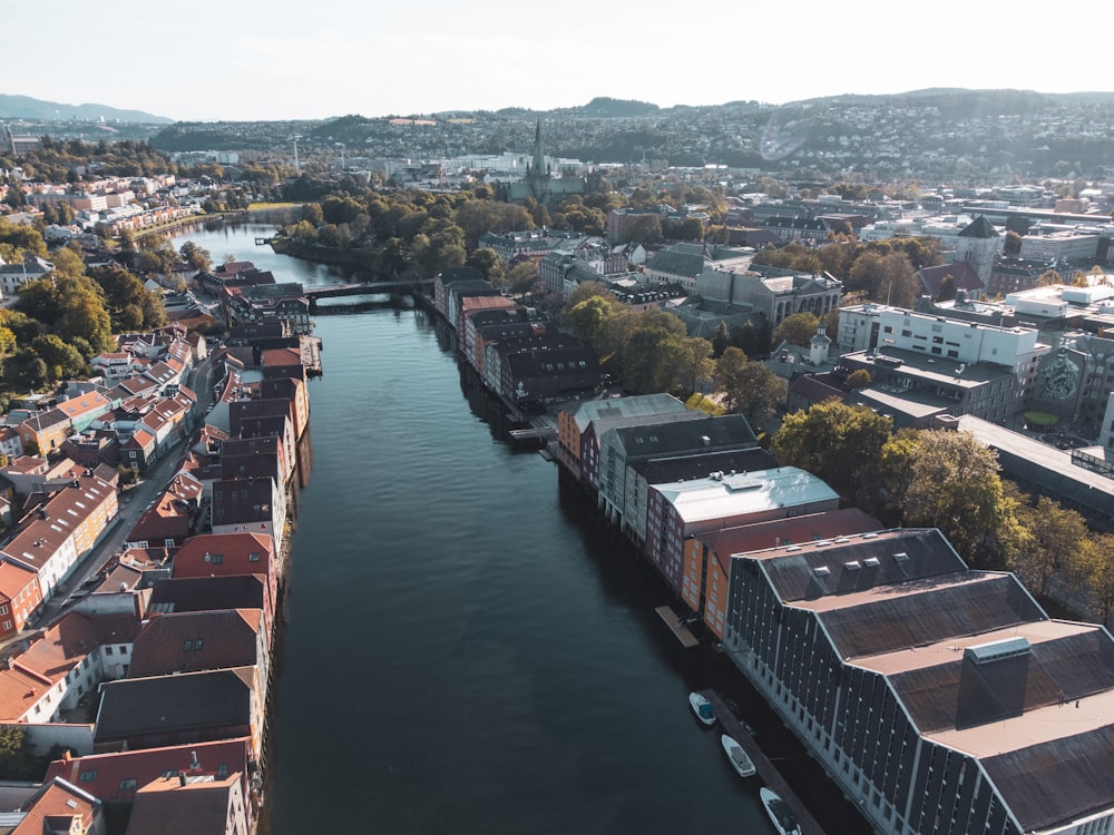 an aerial view of a river running through a city