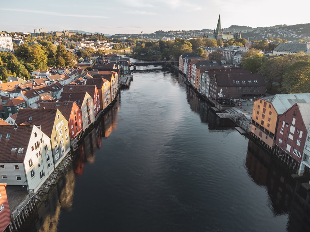 a river running through a city next to tall buildings