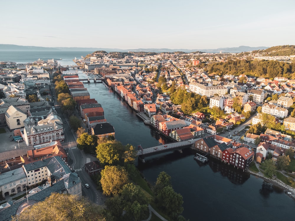 an aerial view of a river running through a city