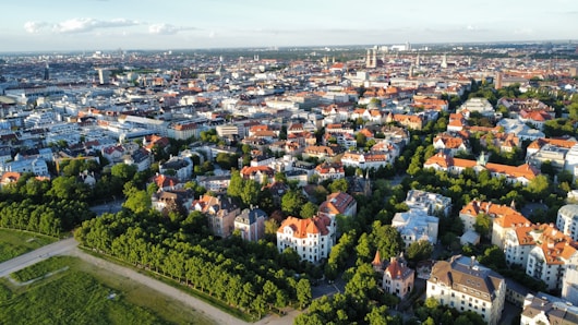 an aerial view of a city with lots of trees