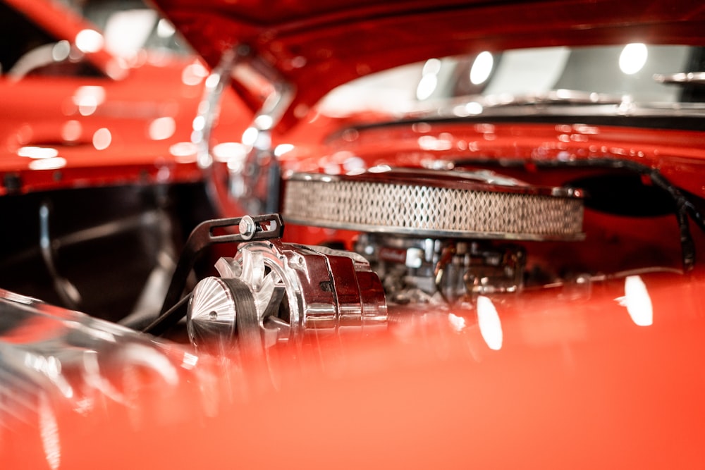 a close up of the hood of a classic car