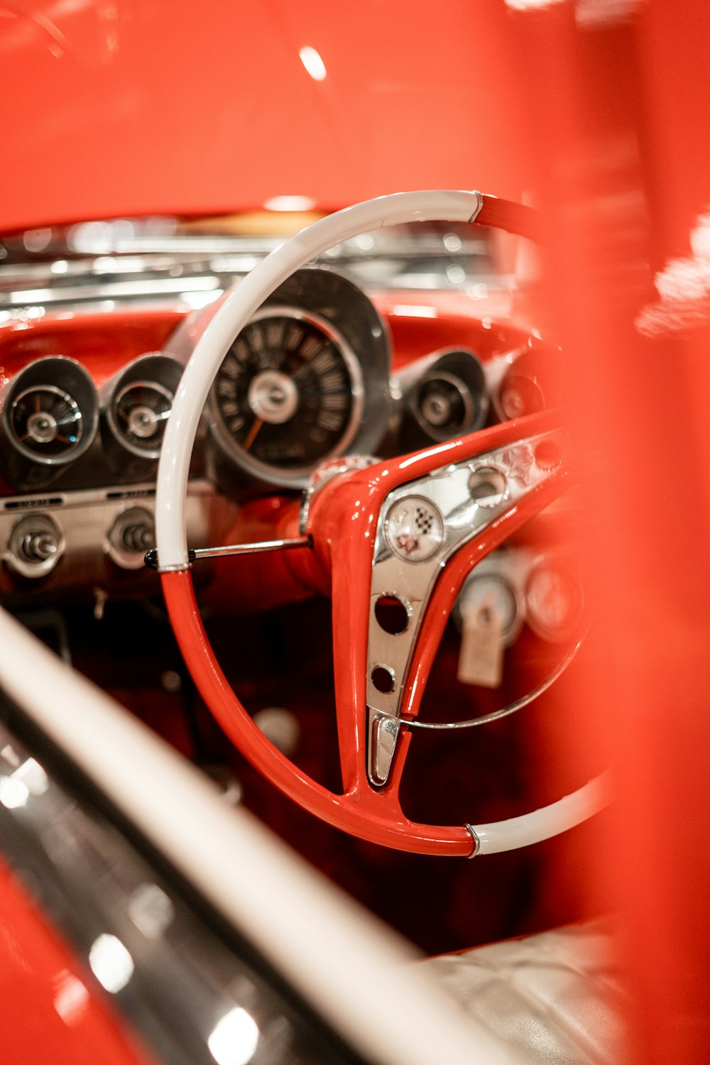 the interior of a classic car with a steering wheel and dashboard