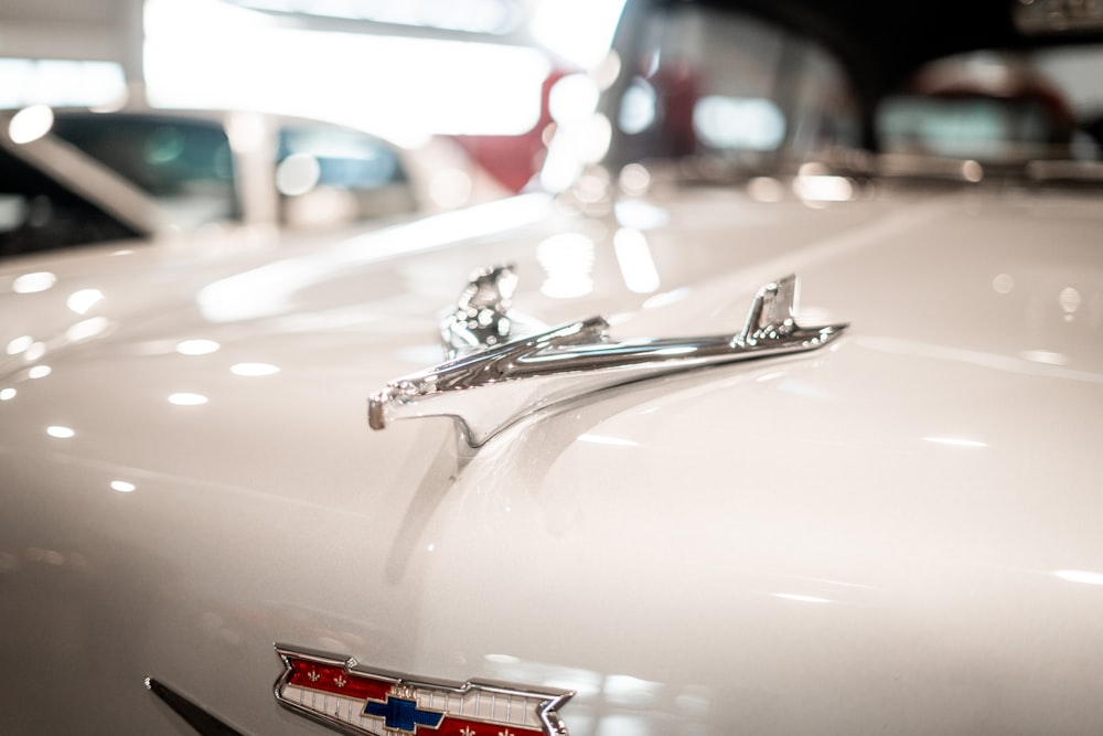 a close up of the hood ornament of a classic car