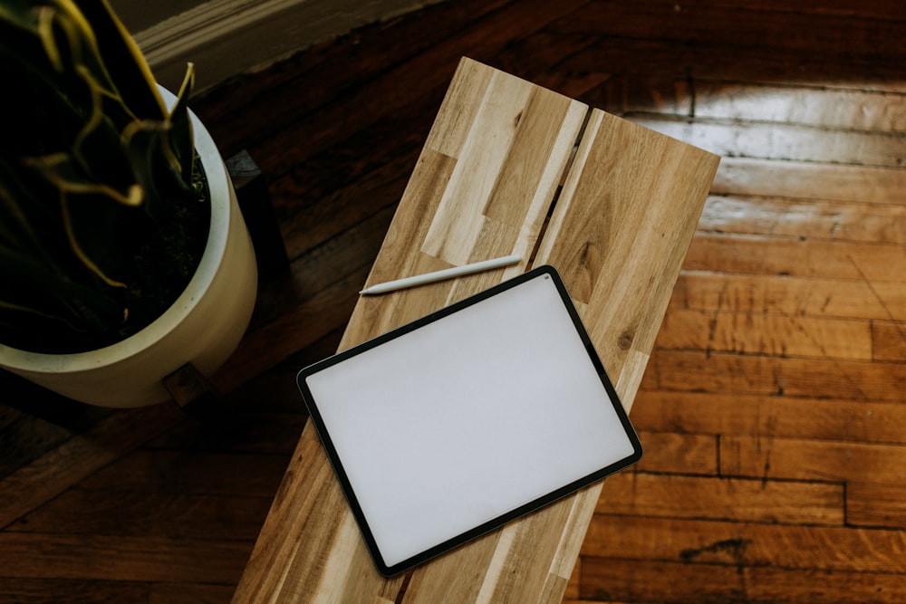 a picture frame sitting on top of a wooden table