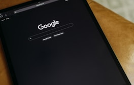 a close up of a cell phone on a table