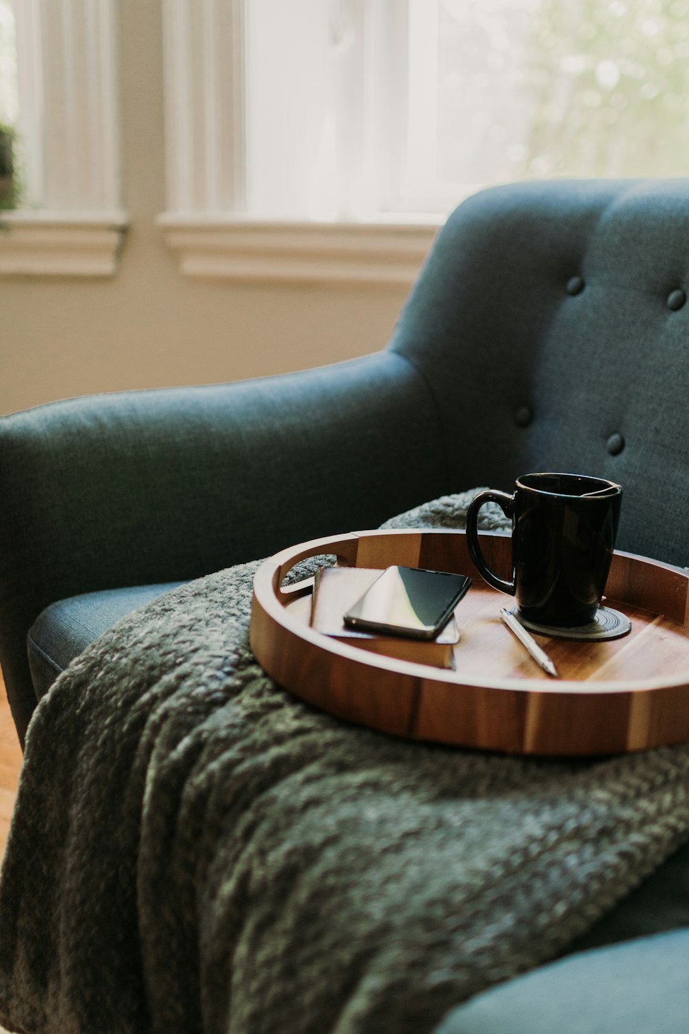 a tray with a coffee cup on top of it