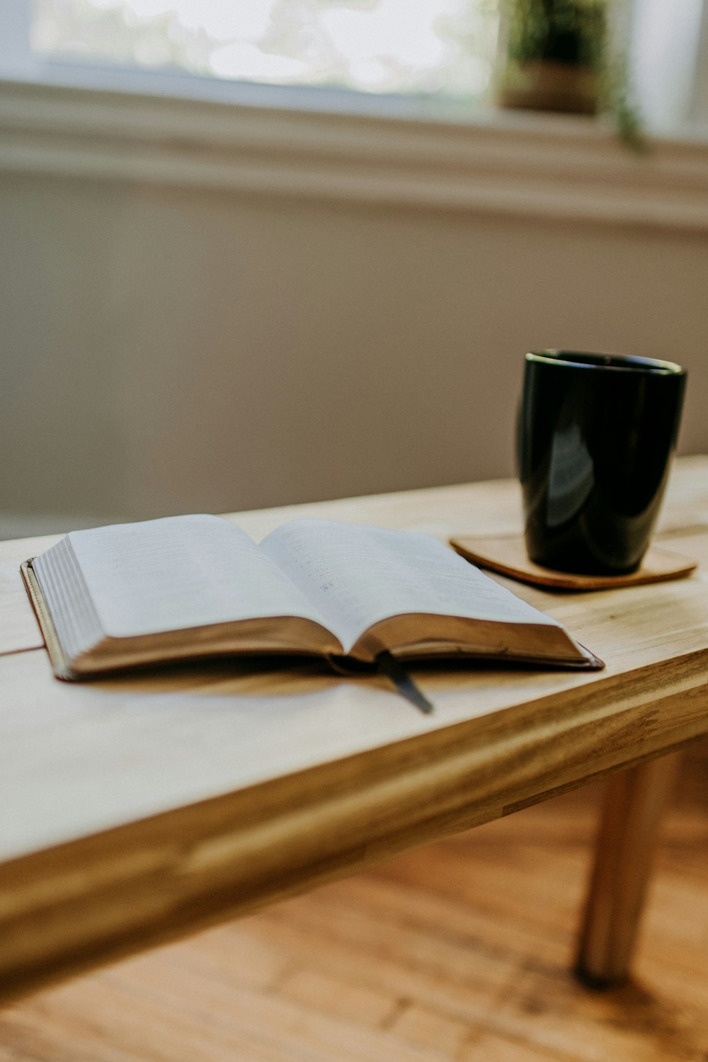 a book and a cup on a table