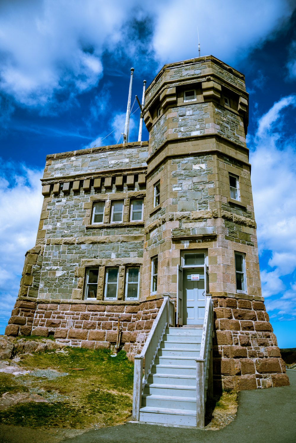 a stone building with a staircase leading up to it