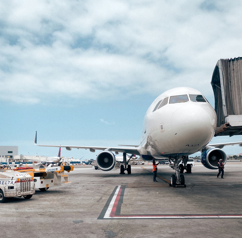 a large jetliner sitting on top of an airport tarmac