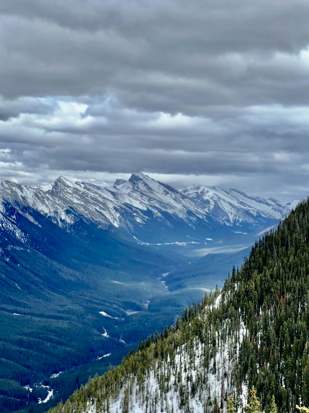 a view of a mountain range with snow on the mountains