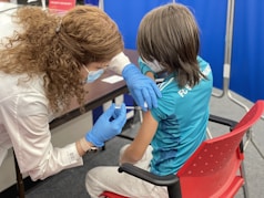 a woman getting her teeth checked by a dentist