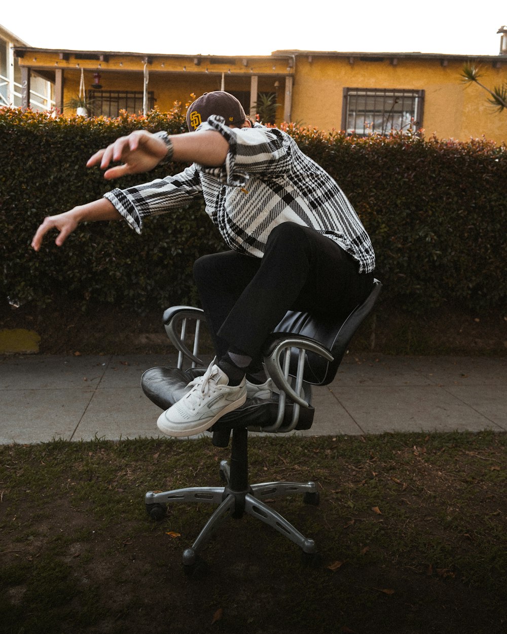 a person jumping in the air on a chair