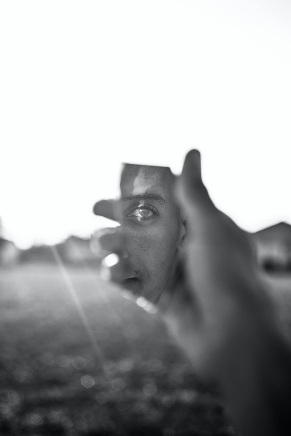 a black and white photo of a man making a face