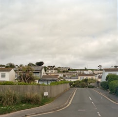 Cozy family houses lined up on a quiet suburban street.