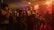 A corporate event with attendees enjoying music and dancing.