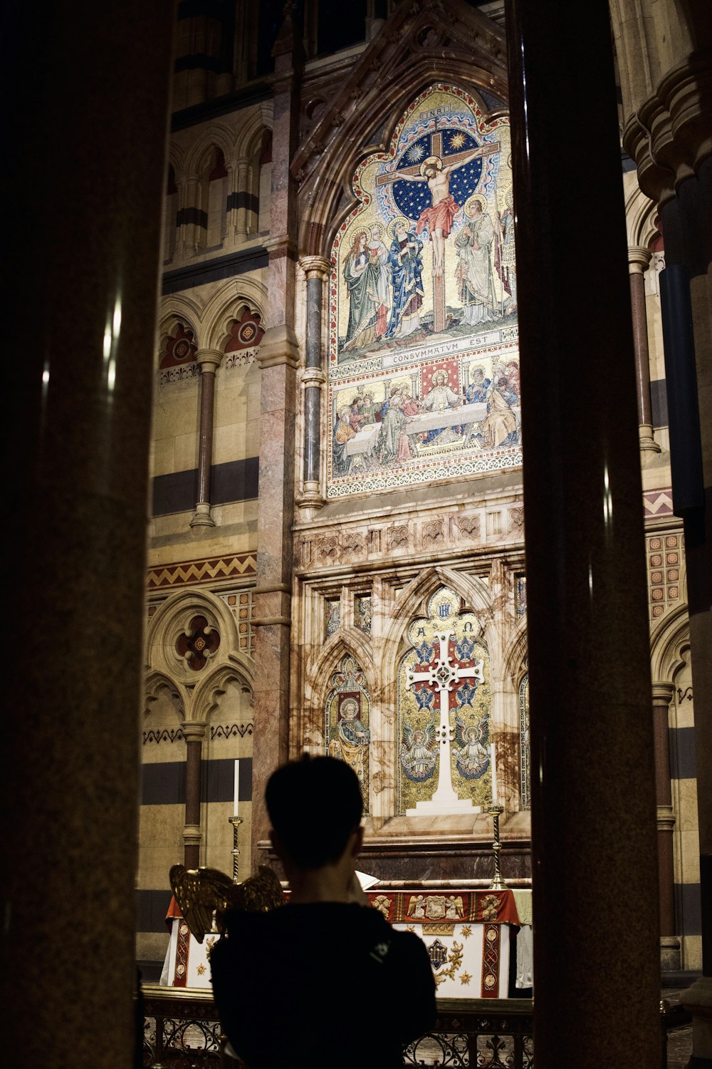 a person standing in front of a church alter