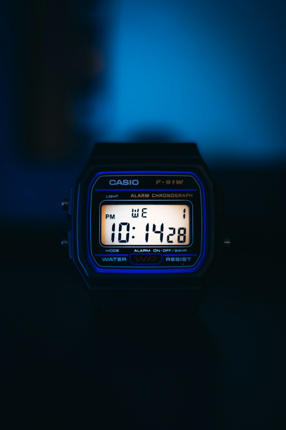 a close up of a digital watch on a table