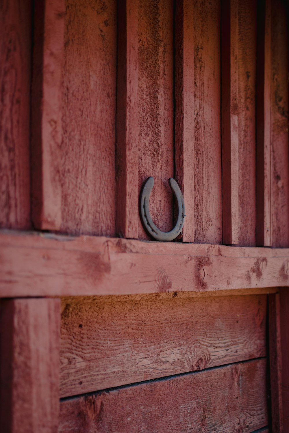 a wooden door with a metal ring on it