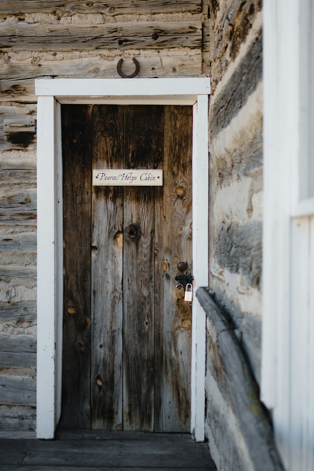 a wooden door with a sign on it