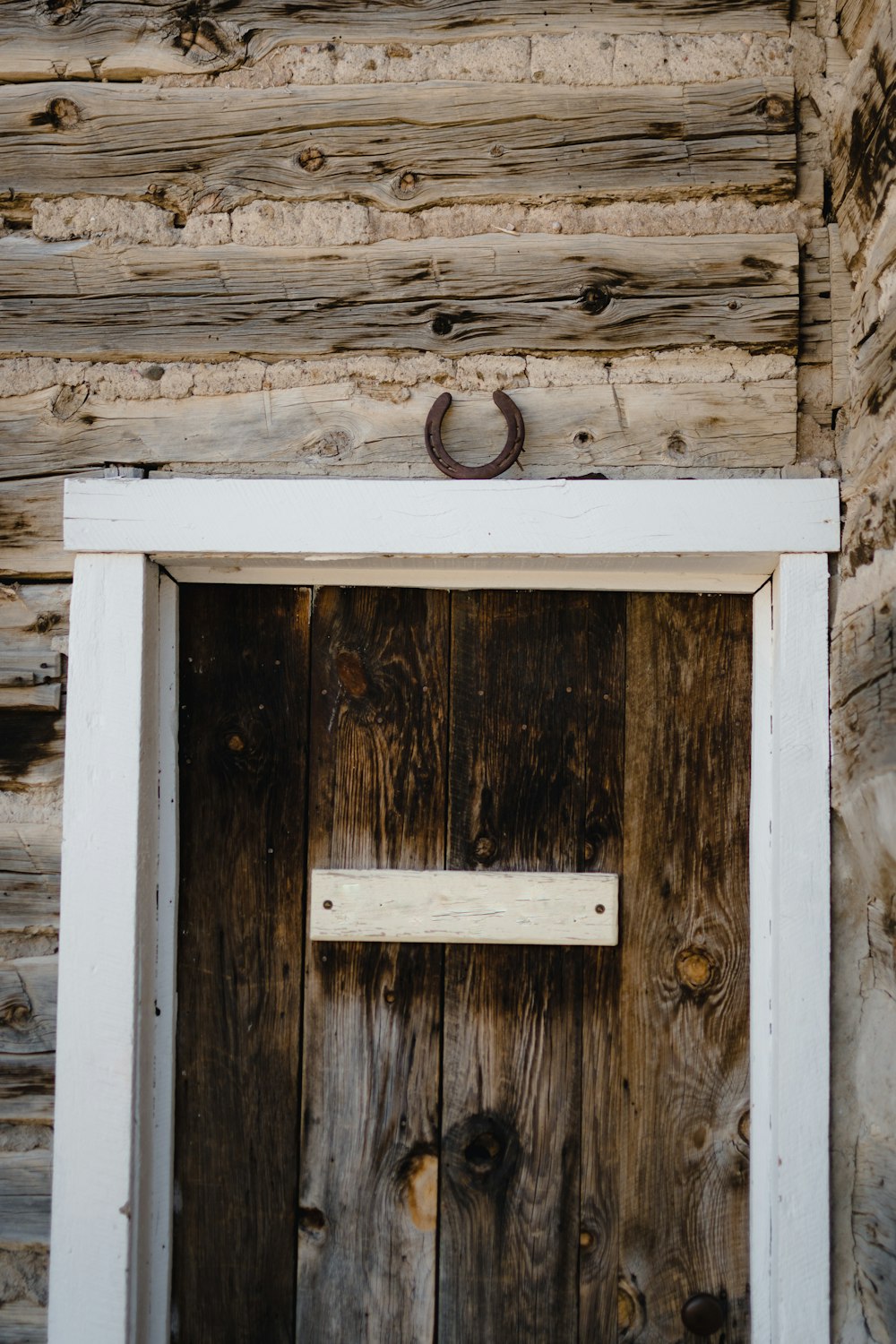 a wooden door with a sign on it