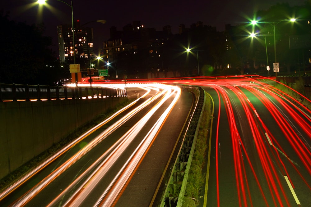 a city street filled with lots of traffic at night