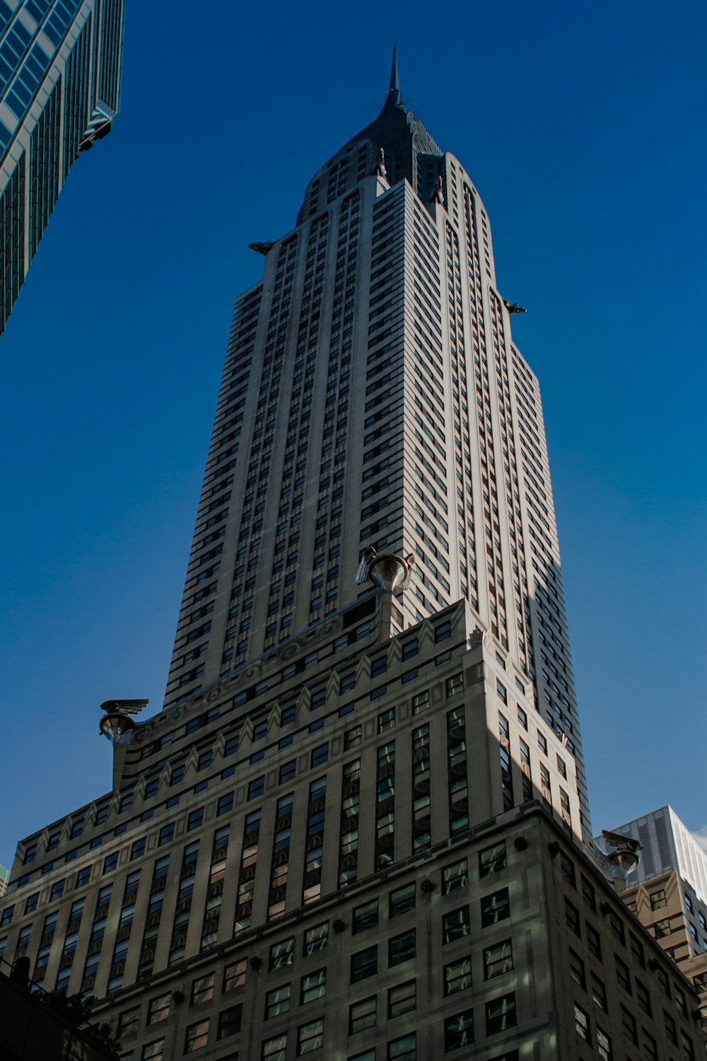 a very tall building towering over a city