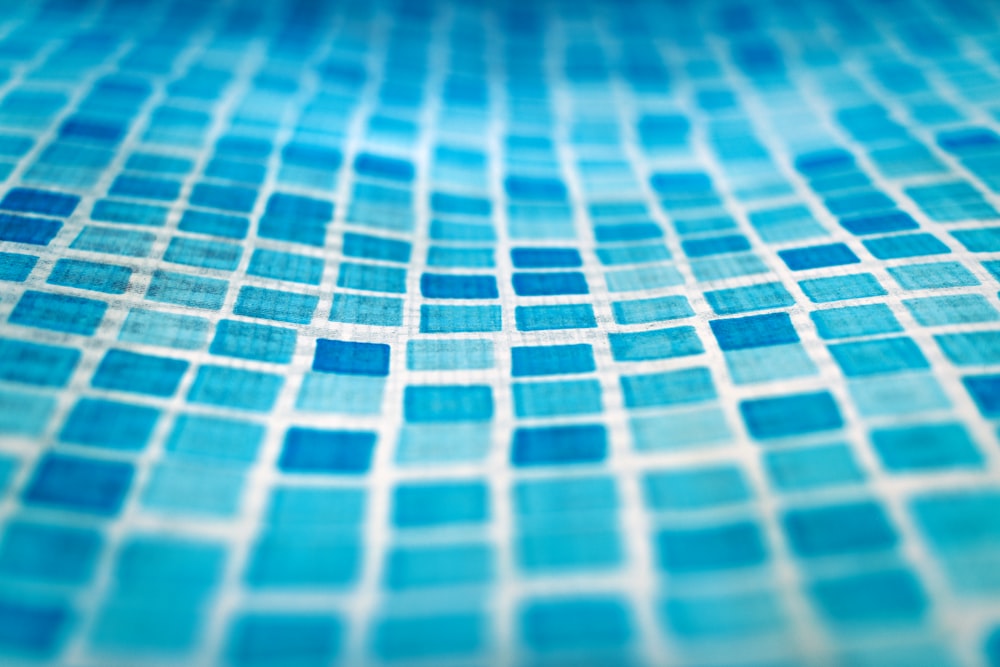 a close up of a blue tiled surface