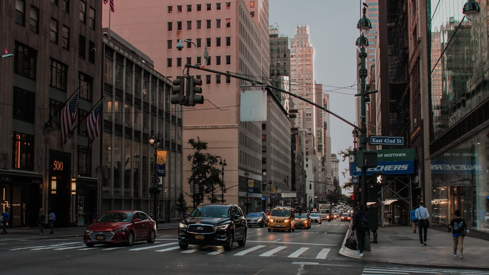 a city street filled with traffic and tall buildings