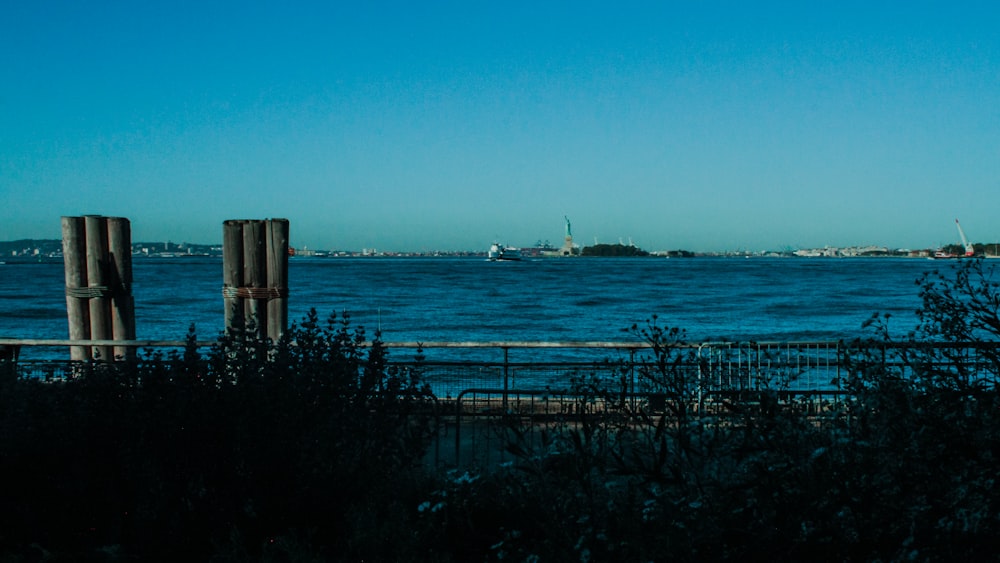 a body of water with a boat in the distance