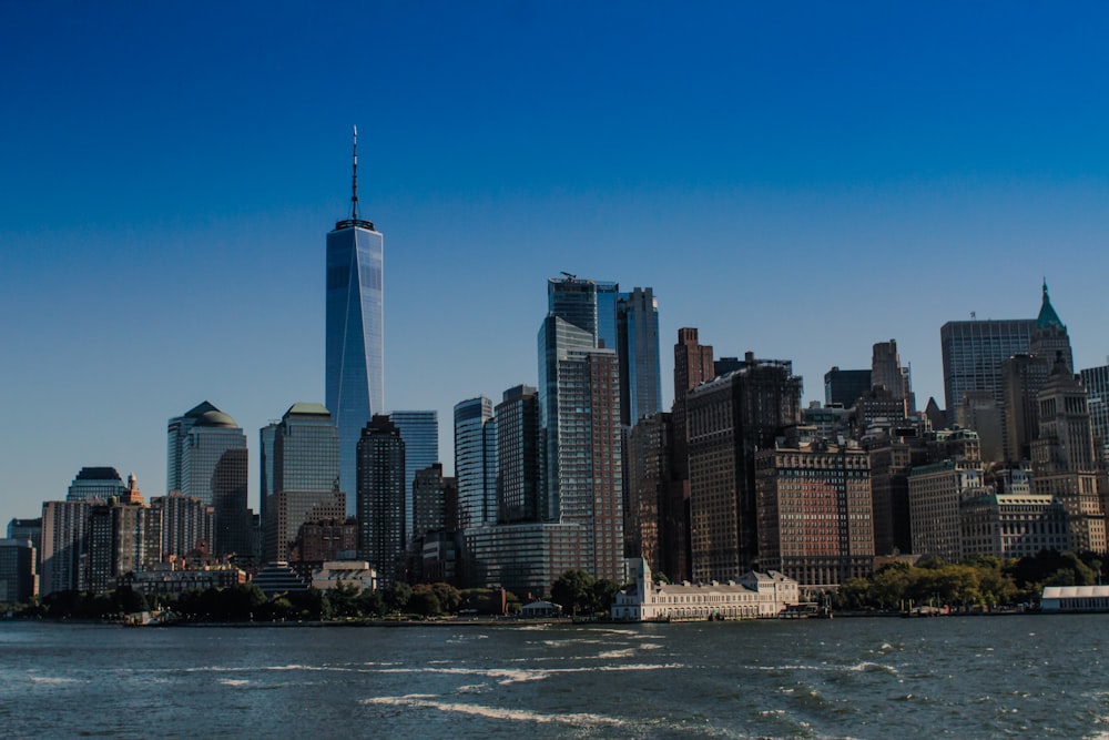 a large body of water with a city in the background