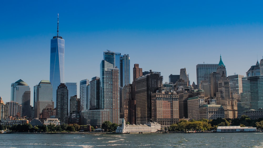 a large body of water with a city in the background