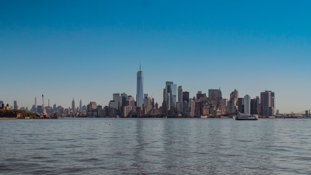 a large body of water with a city in the background