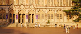 A welcoming entrance of the Darul Huda campus with banners and greenery.