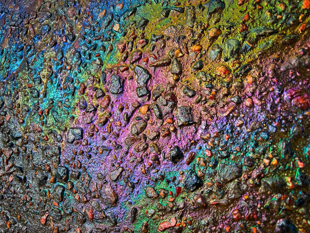 a multicolored painting of rocks on a wall