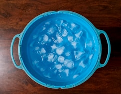 an ice bucket filled with solar cleaner