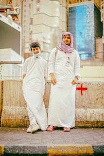 a couple of people standing next to each other