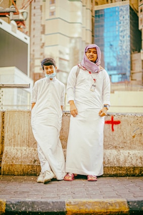a couple of people standing next to each other