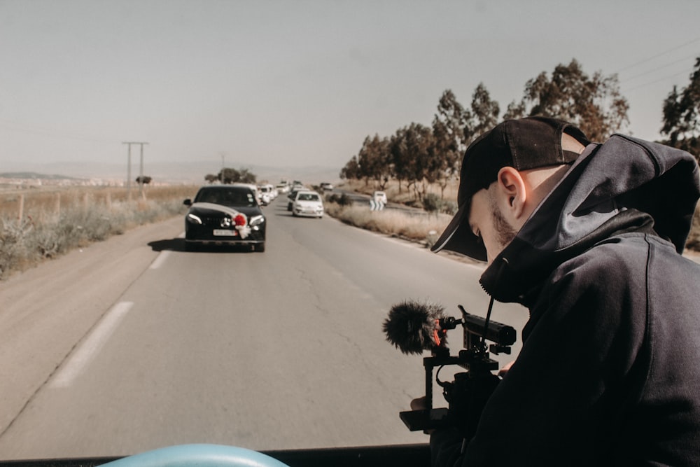 a man on a motorcycle driving down a road