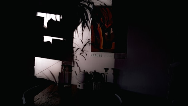 A softly lit corner with a steaming teapot, wooden table, and a small potted plant beside a window.